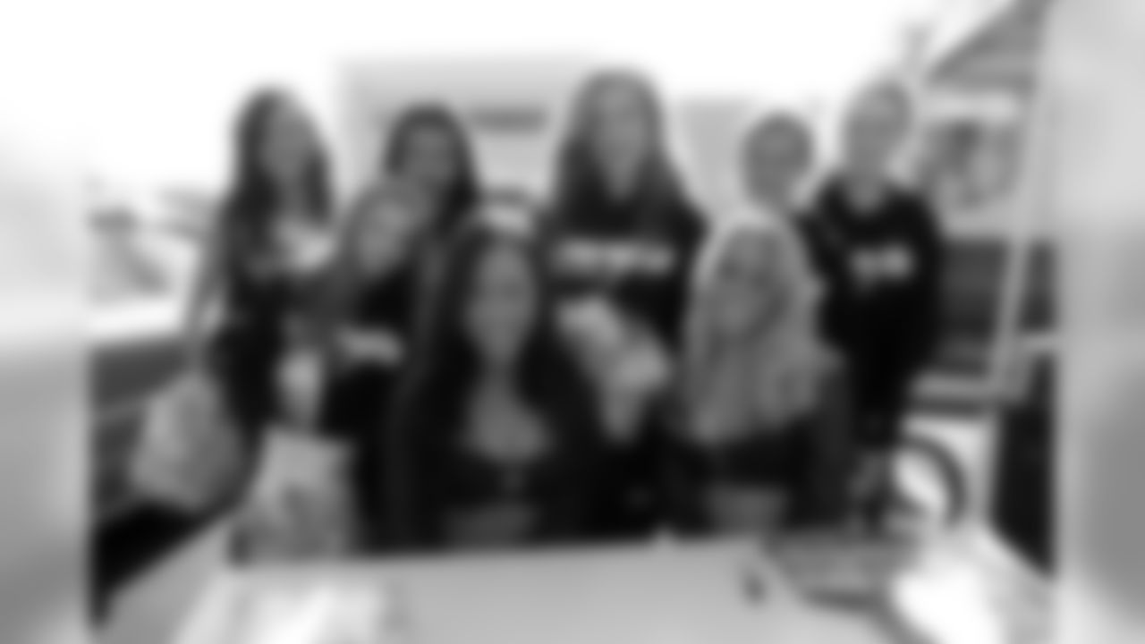 Kelly and Erica posed with fellow cheerleaders on November 2nd.