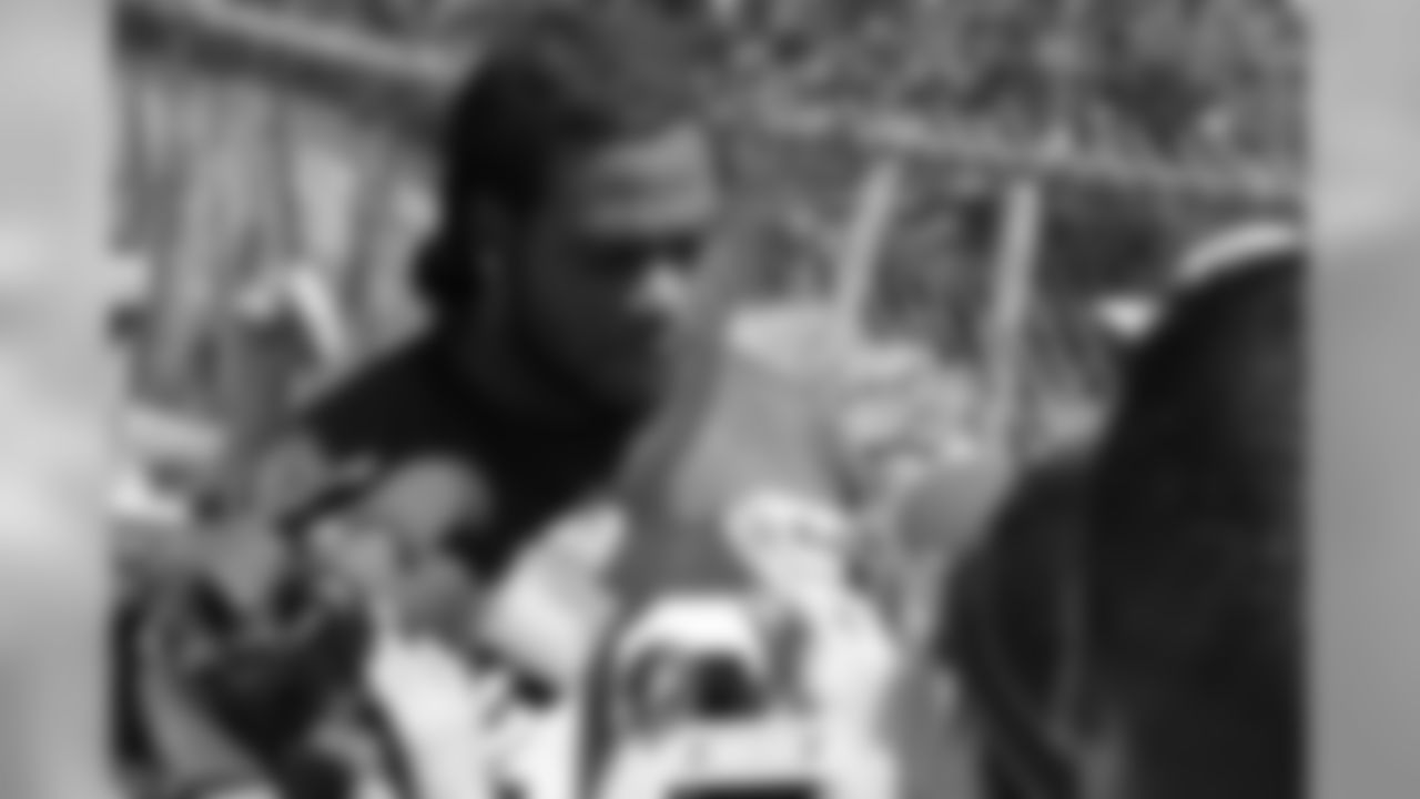 Jermaine Cunningham talks with the media