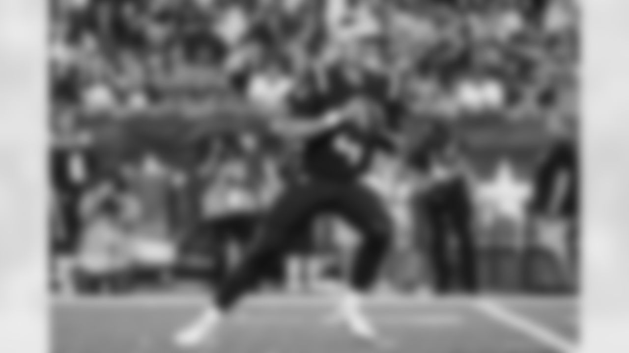 New England Patriots quarterback Bailey Zappe (4) drops back to make a pass