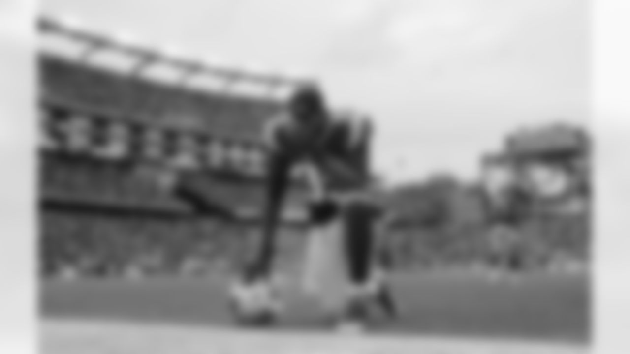 New England Patriots defensive end Chandler Jones (95) takes a moment before an NFL football game against the Buffalo Bills, Sunday, Dec. 28, 2014, in Foxborough, Mass. (AP Photo/Elise Amendola)
