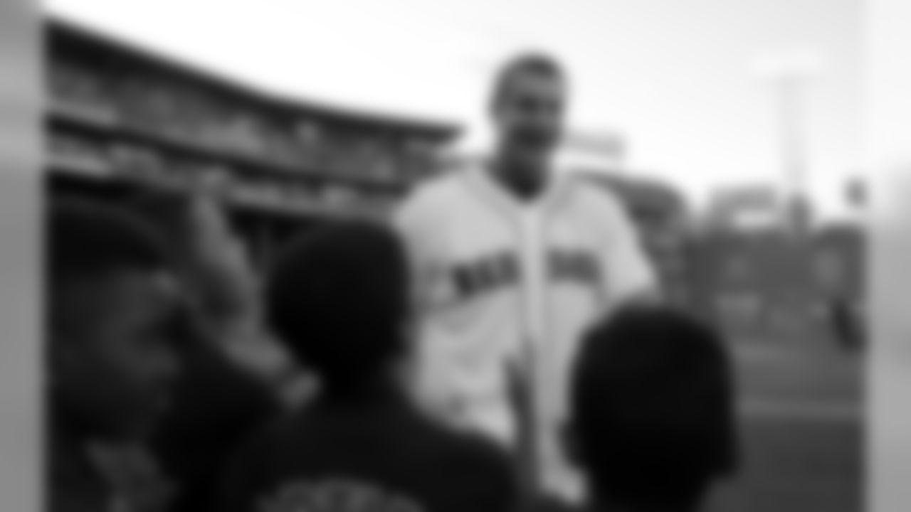 New England Patriots tight end Rob Gronkowski greets fans prior to throwing out the ceremonial first pitch prior to a baseball game at Fenway Park, Tuesday, July 19, 2016, in Boston. (AP Photo/Charles Krupa)