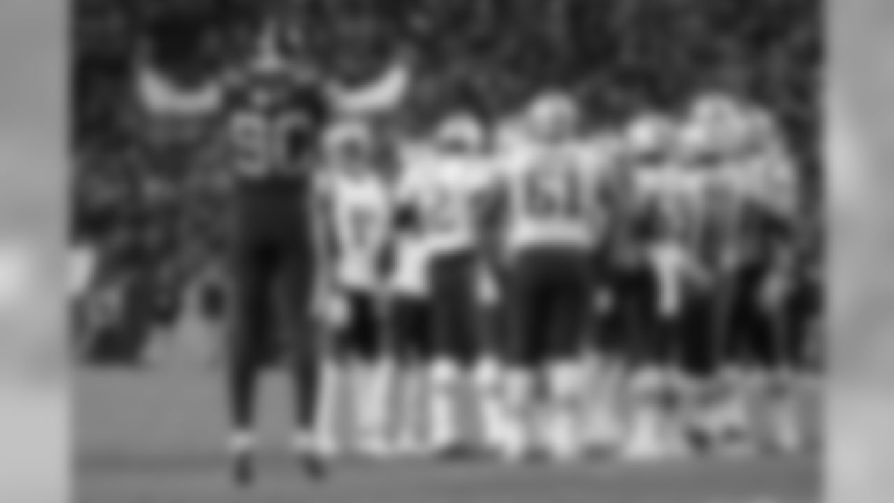 Pittsburgh Steelers outside linebacker T.J. Watt (90) calls the crowd to action as New England Patriots quarterback Tom Brady (12) huddles his team during the second half of an NFL football game in Pittsburgh, Sunday, Dec. 16, 2018. The Steelers won 17-10. (AP Photo/Don Wright)