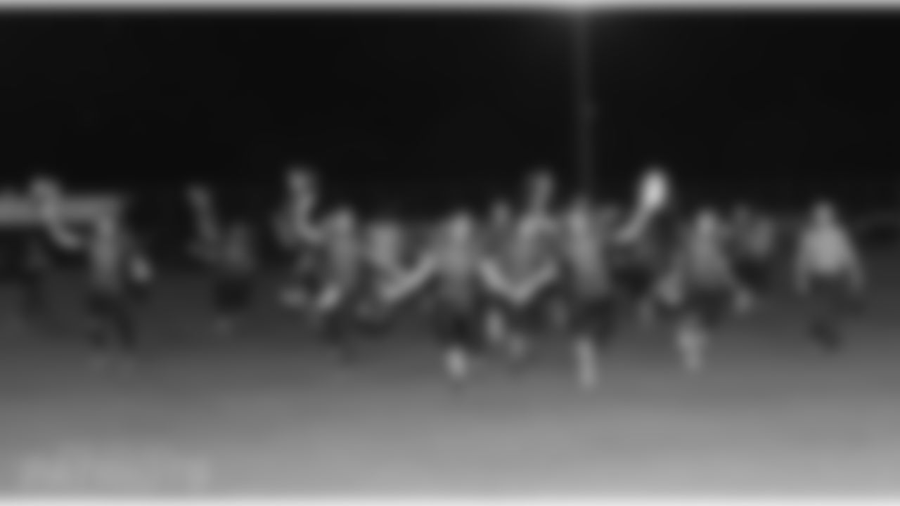Players of an Israeli Football League team rush the field following a victory.