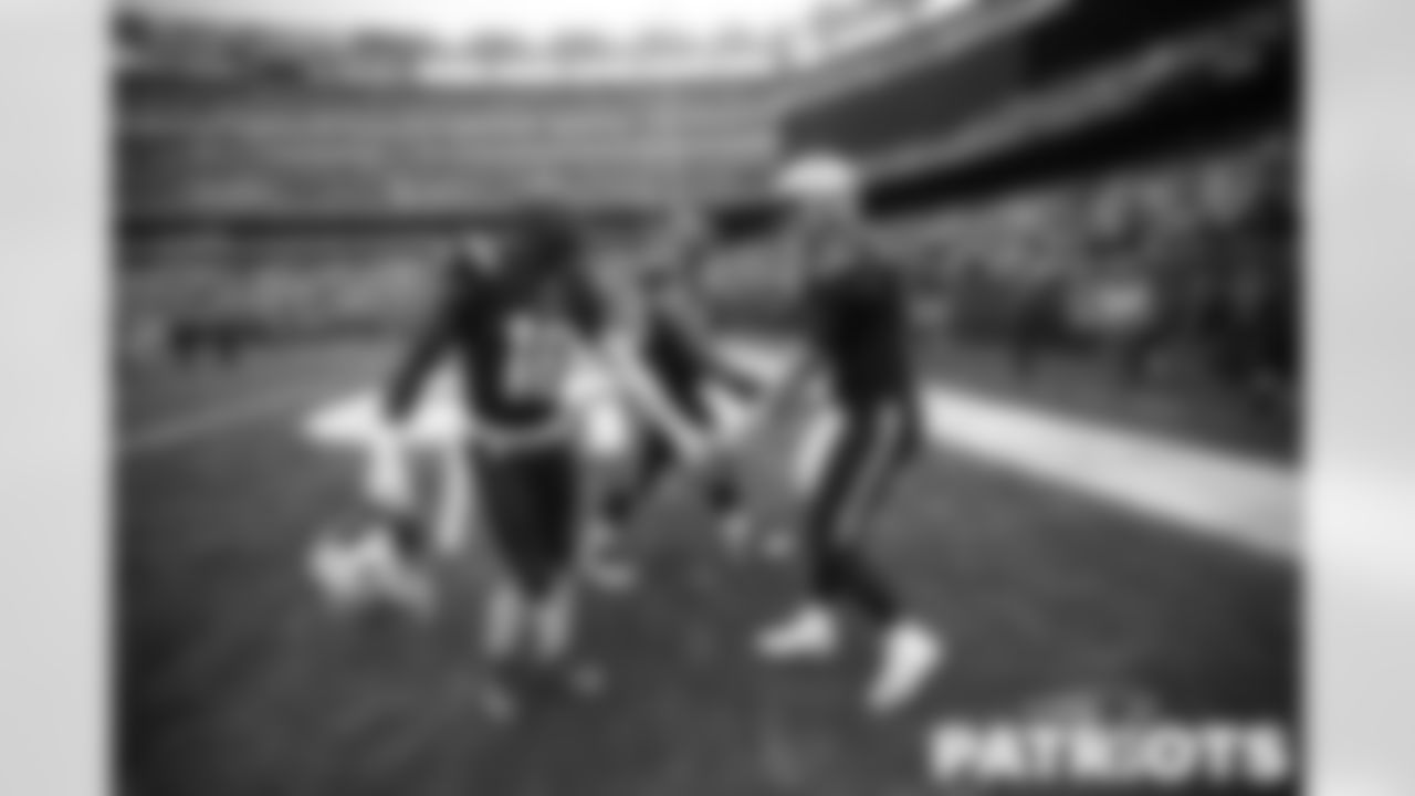 Patriots quarterback Mac Jones (10) and special teams captain Matthew Slater (18).
