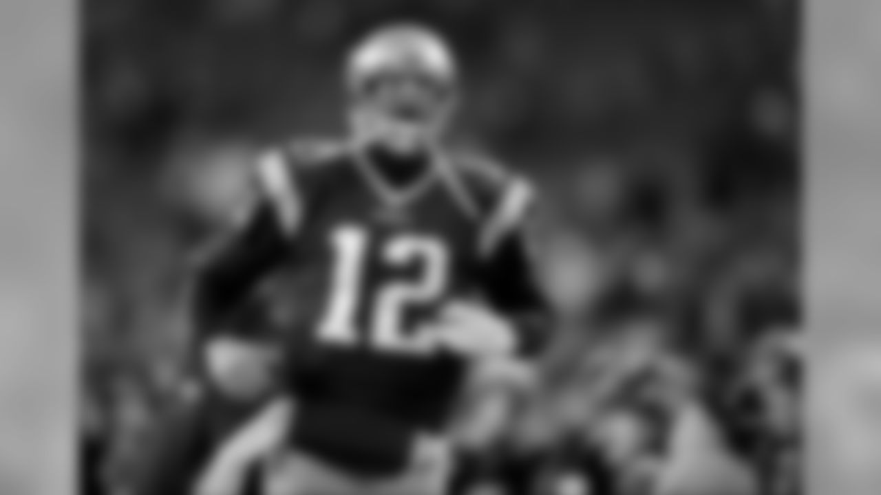 New England Patriots quarterback Tom Brady shouts as he takes the field to warm up before an NFL divisional playoff football game against the Houston Texans, Saturday, Jan. 14, 2017, in Foxborough, Mass. (AP Photo/Charles Krupa)
