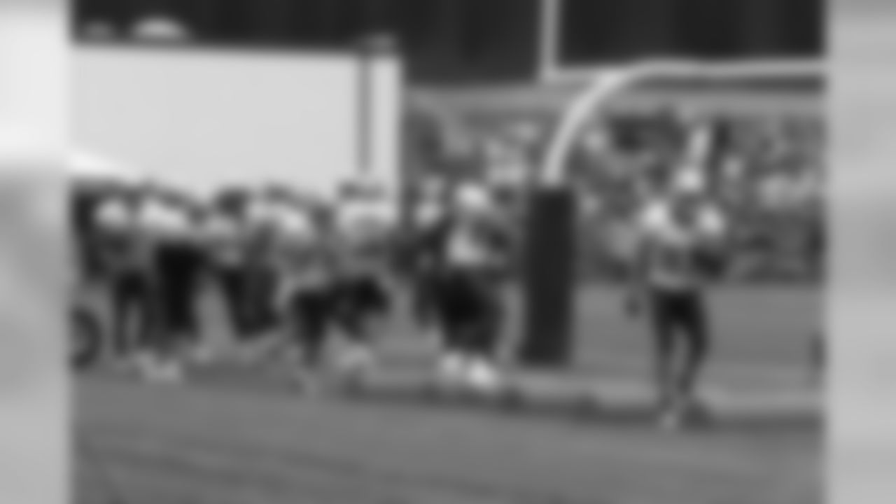 Wes Welker and Chad Ochocinco run through a drill at training camp