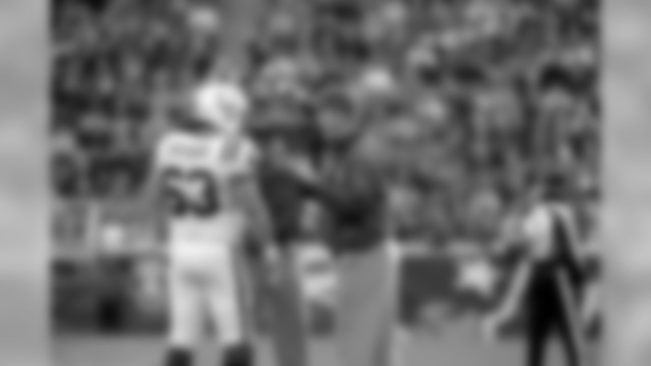 Even with a kneck injury, Colts QB Peyton Manning helps C Jeff Saturday during Sunday's game