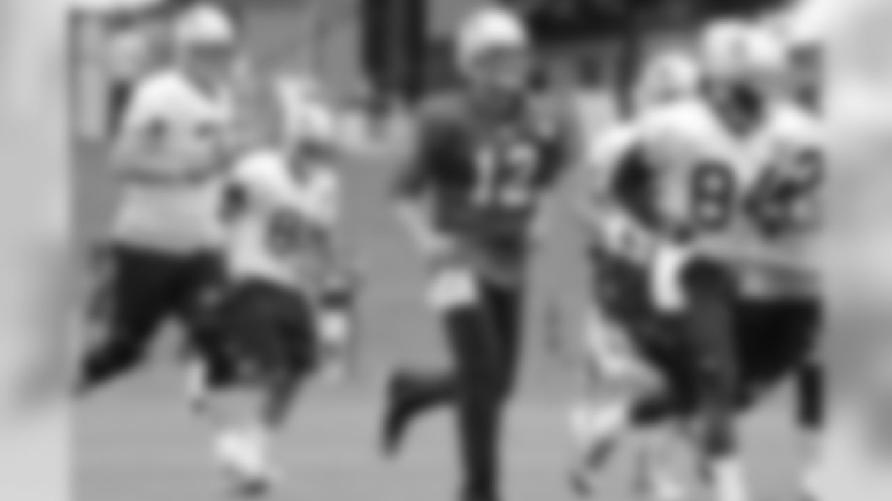 Tom Brady and the offense get in some running at practice.