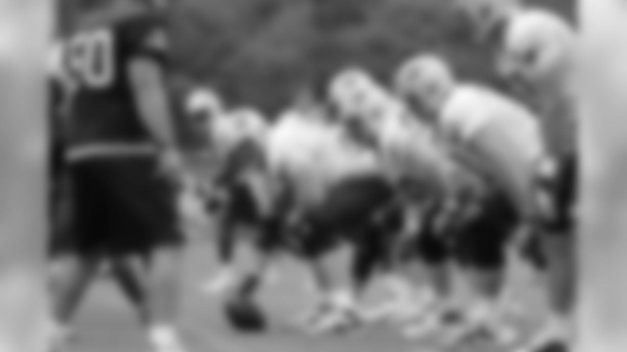 The offensive line prepares for the snap at practice.