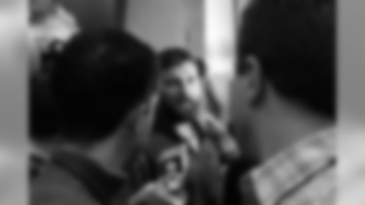 Rob Ninkovich surrounded by a crowd of media