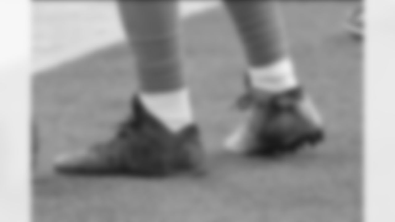 Los Angeles Chargers quarterback Tyrod Taylor (5) wears his MCMC cleats during an NFL football game against the New England Patriots, Sunday, December 6, 2020, in Inglewood, Calif. (AP Photo/Peter Joneleit)