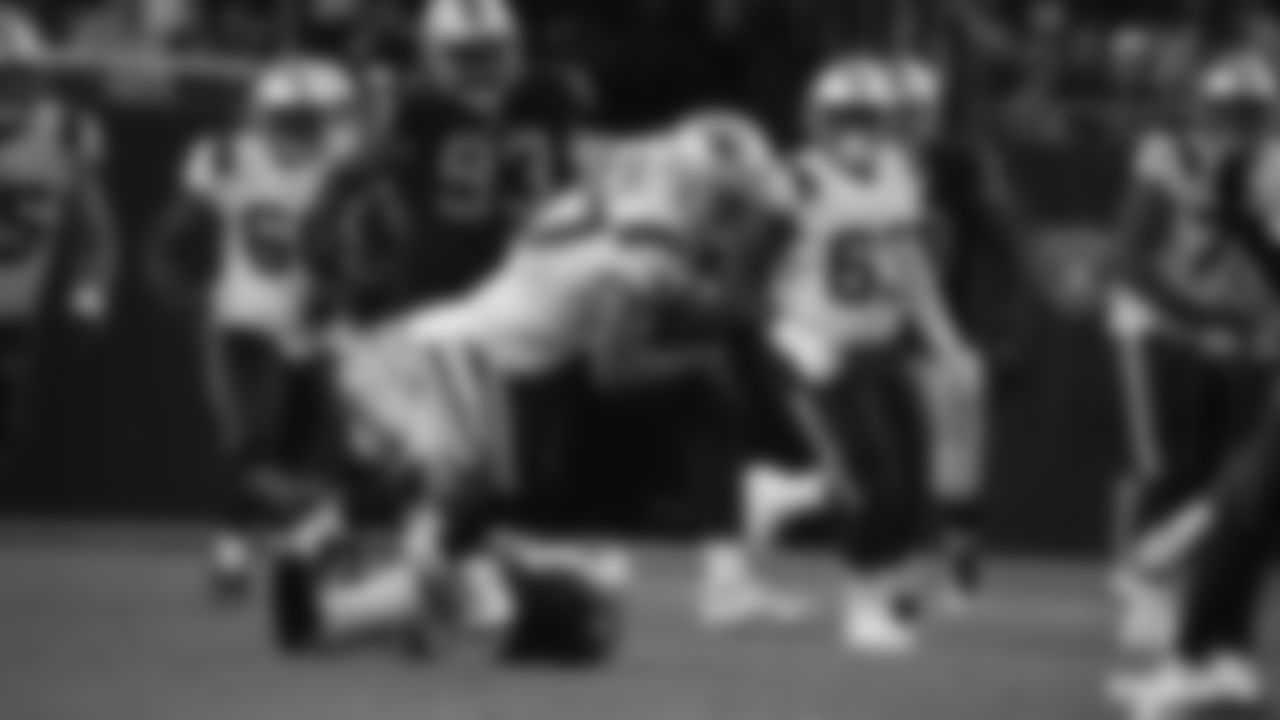 Matt Sokol (87) avoids Raiders Amik Robertson's (21) tackle and falls forward for a gain
