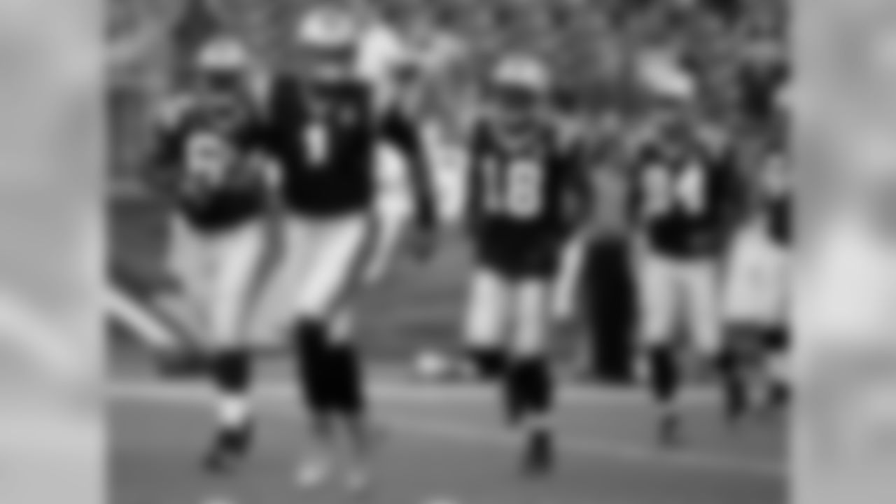 Carolina Panthers quarterback Cam Newton leads his team onto the field before an NFL preseason football game against the New England Patriots Friday, Aug. 22, 2014, in Foxborough, Mass. (AP Photo/Stephan Savoia)