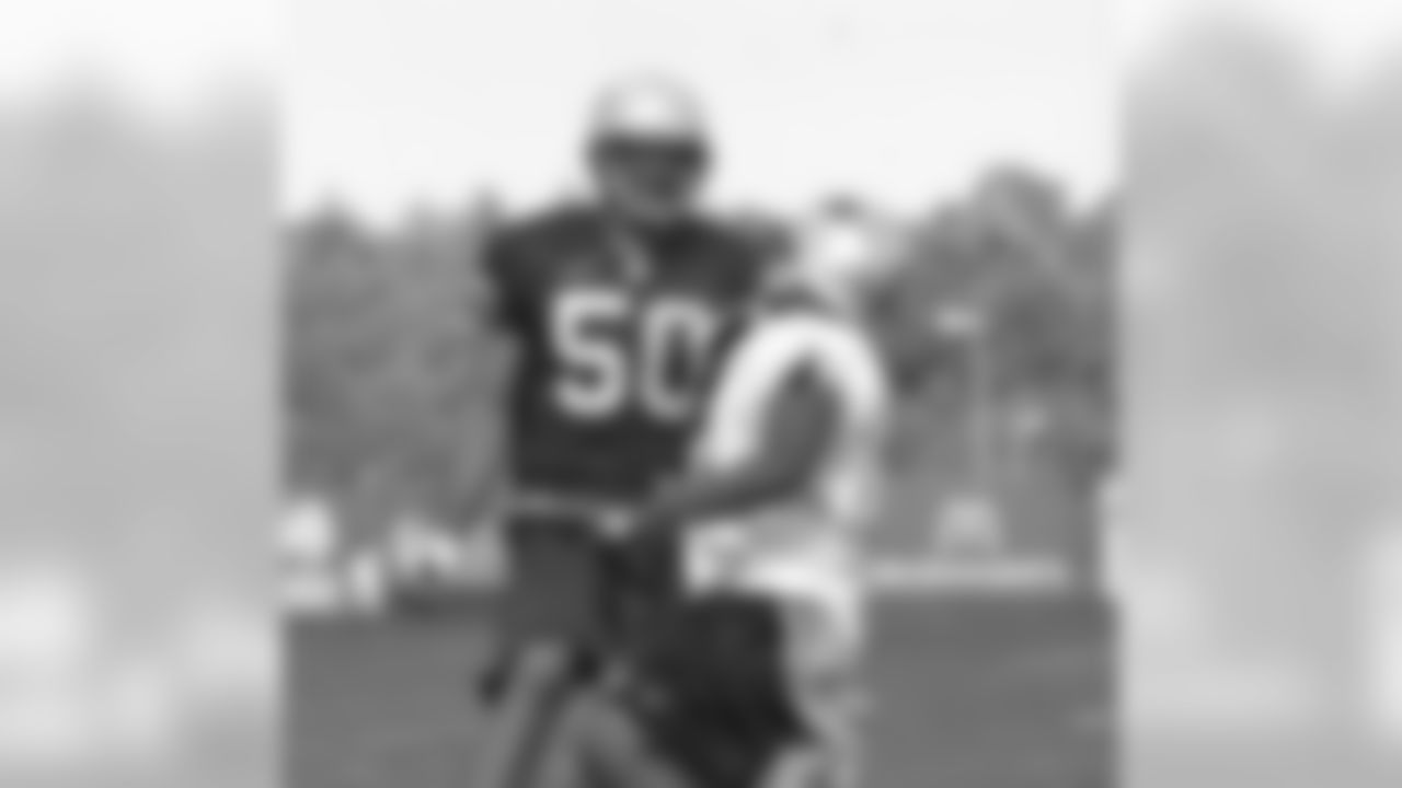 Linebacker Mike Vrabel(50) covers wide receiver Bam Childress(13) during afternoon practice session on Thursday, August 17. Photo by Chris Ferreira