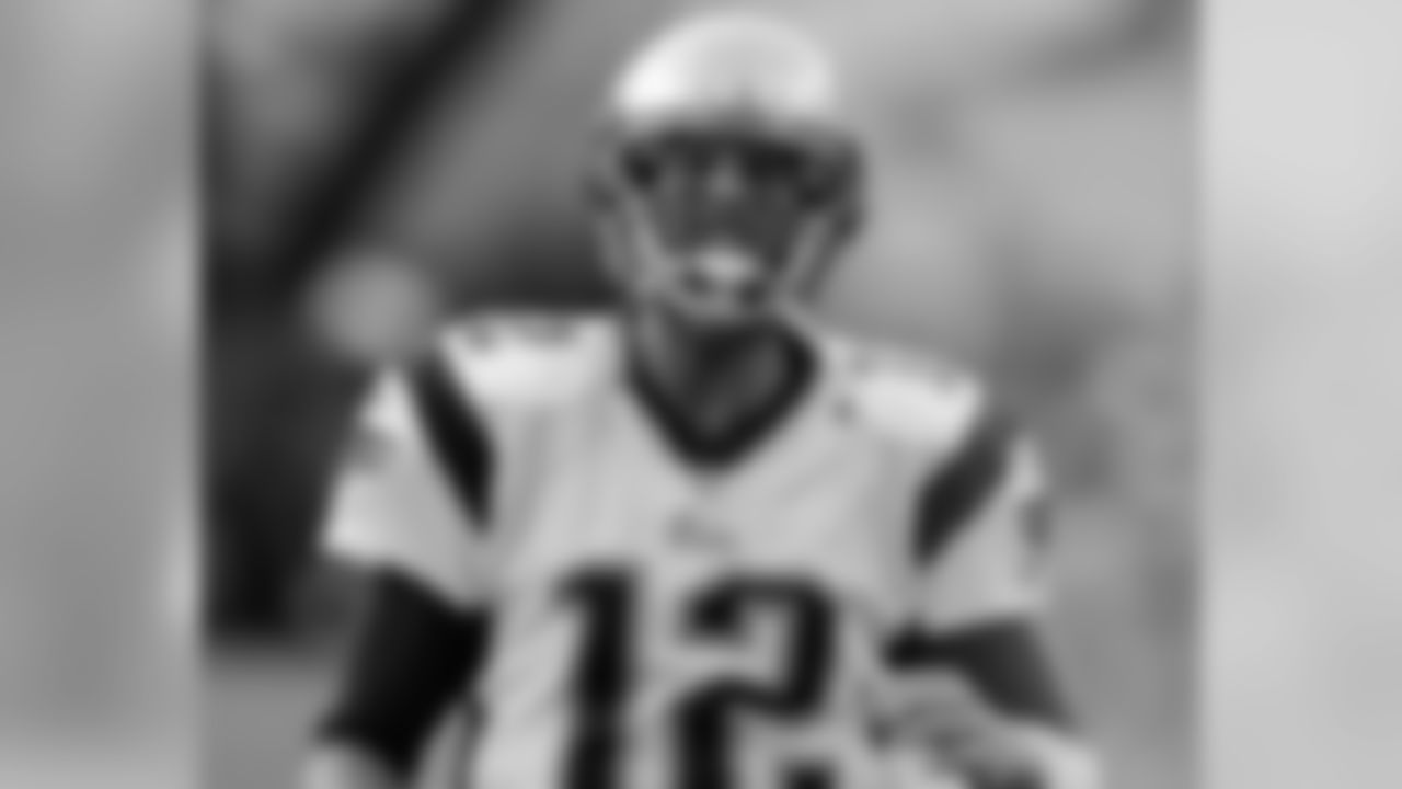New England Patriots quarterback Tom Brady takes the field before an NFL preseason football game against the Philadelphia Eagles on Friday, Aug. 15, 2014, in Foxborough, Mass. (AP Photo/Charles Krupa)