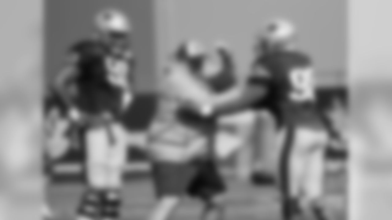 Deatrich Wise Jr., Bret Bielema and Trey Flowers