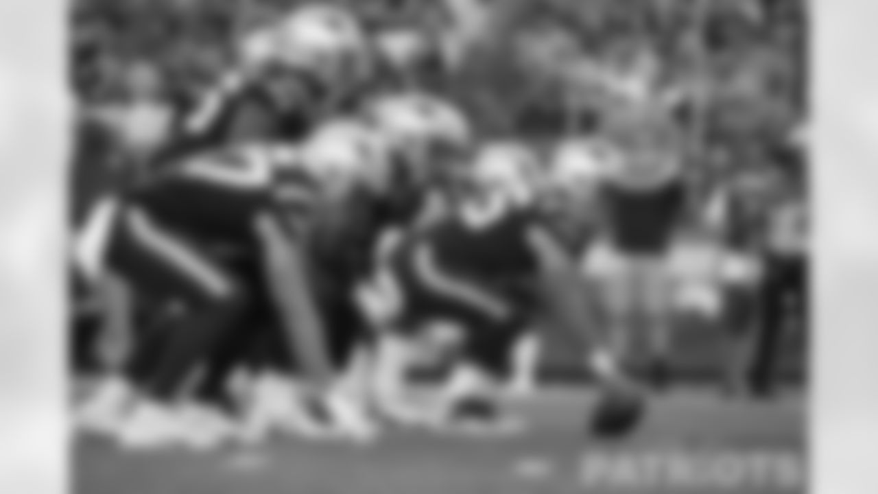 The offensive line at the line of scrimmage.