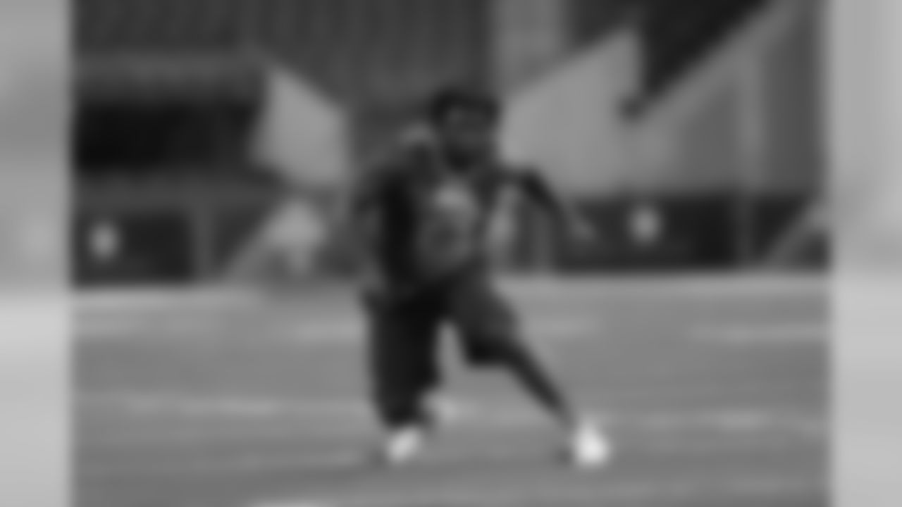 Texas defensive lineman Malcom Brown runs a drill at the NFL football scouting combine in Indianapolis, Sunday, Feb. 22, 2015.