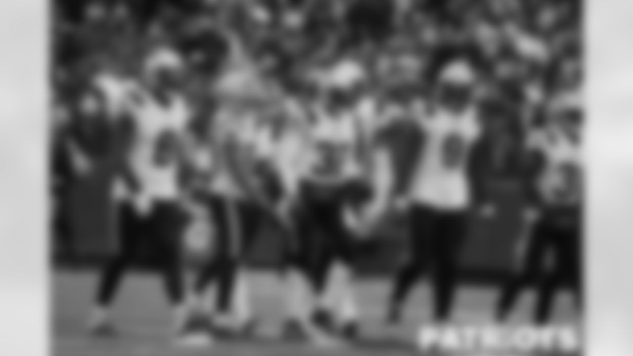 The Patriots defense celebrates Devin McCourty's interception
