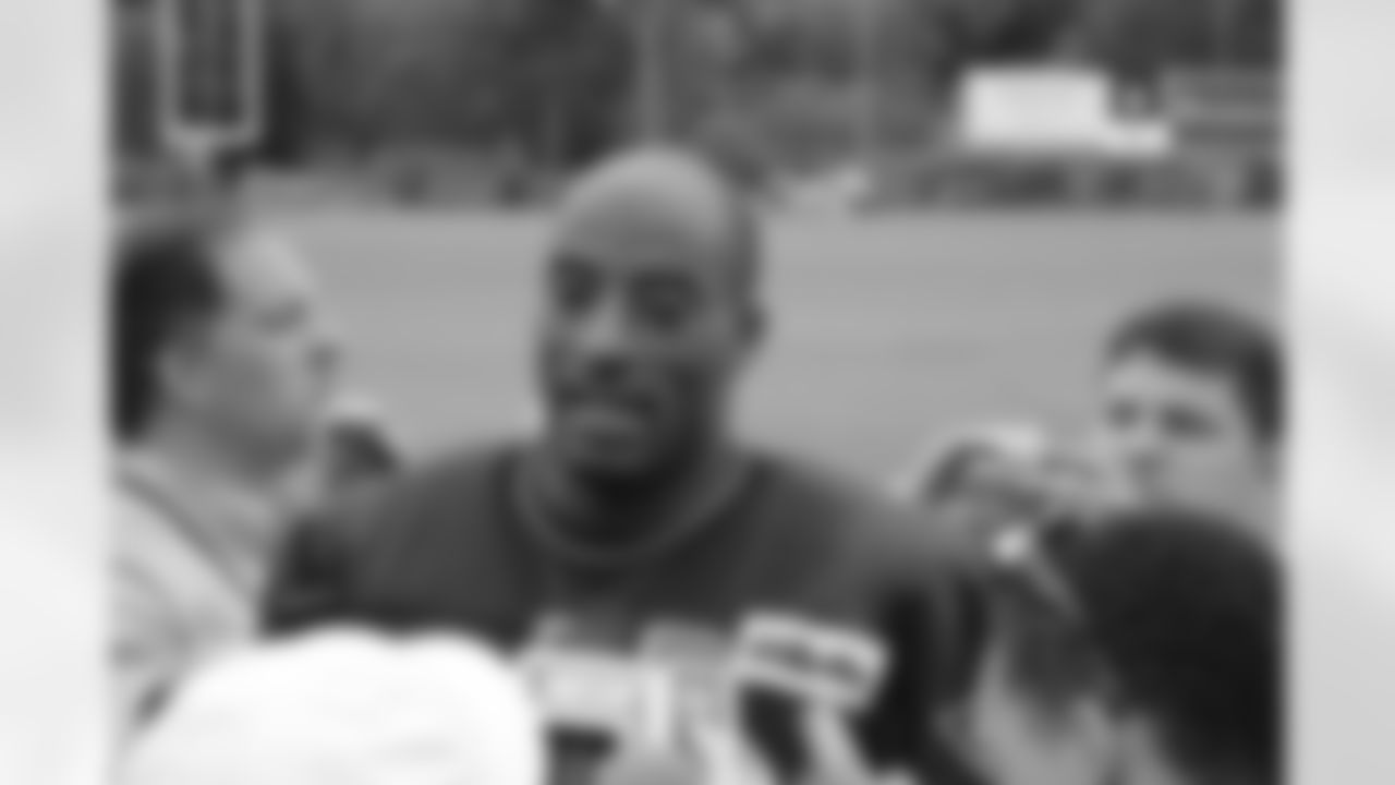 Andre Carter talks with the media