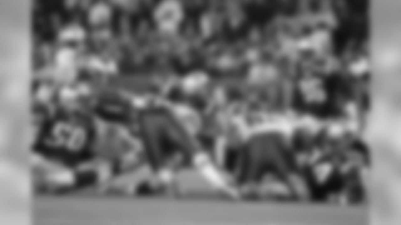 Linebacker Jerod Mayo stopps Kansas City running back Jackie Battle in the hole