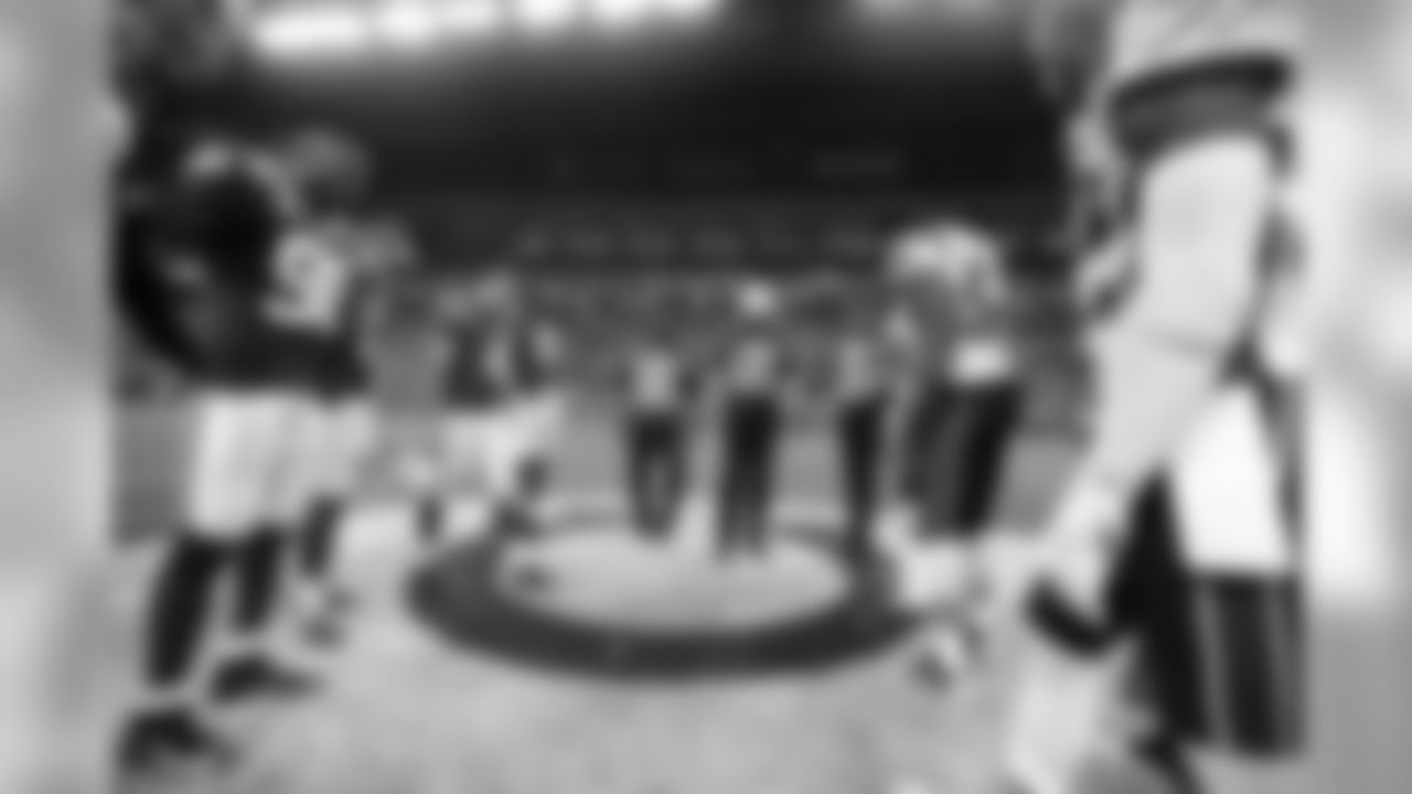 Players watch the coin toss before an NFL football game between the Indianapolis Colts and the New England Patriots in Indianapolis, Sunday, Oct. 18, 2015. (AP Photo/John Minchillo)