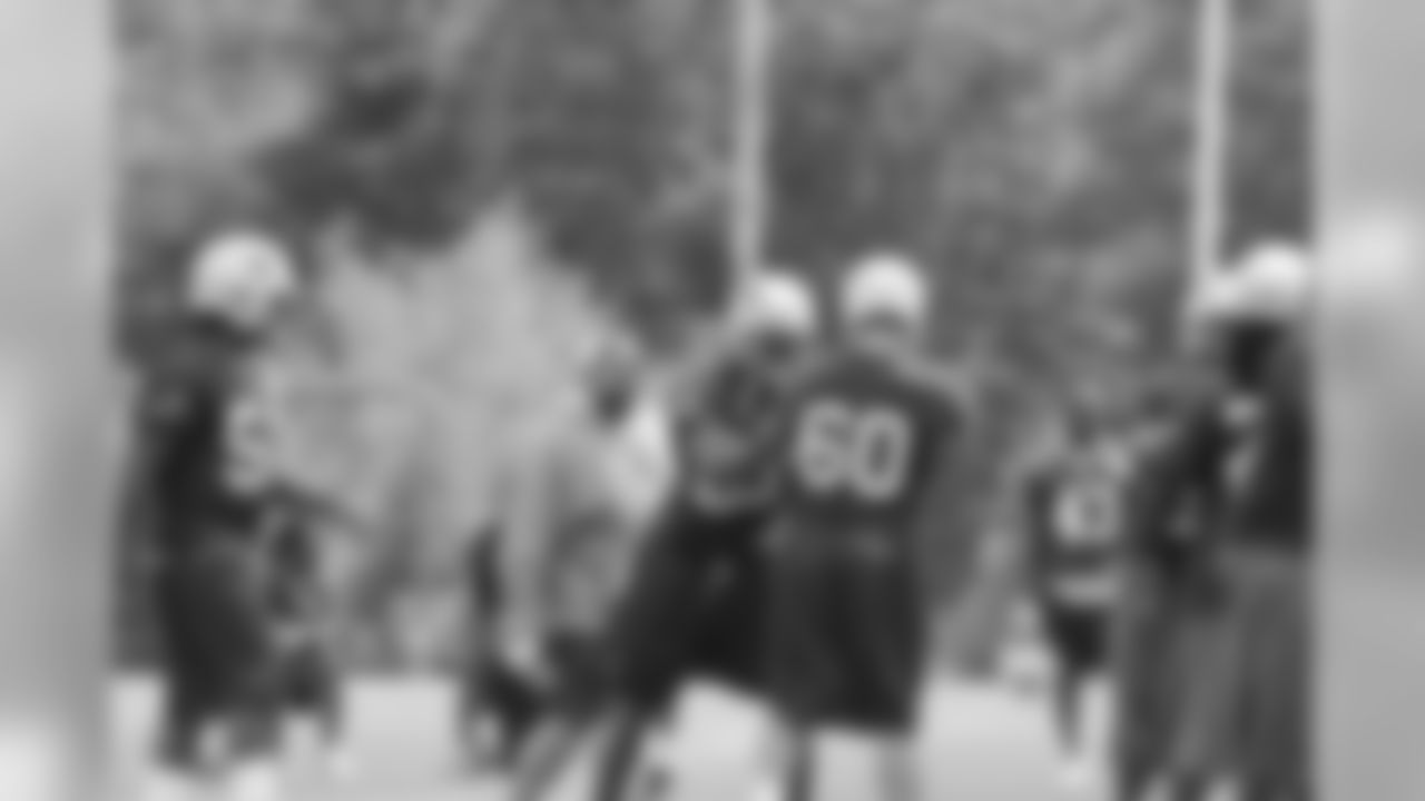 Andre Carter works through a drill at training camp