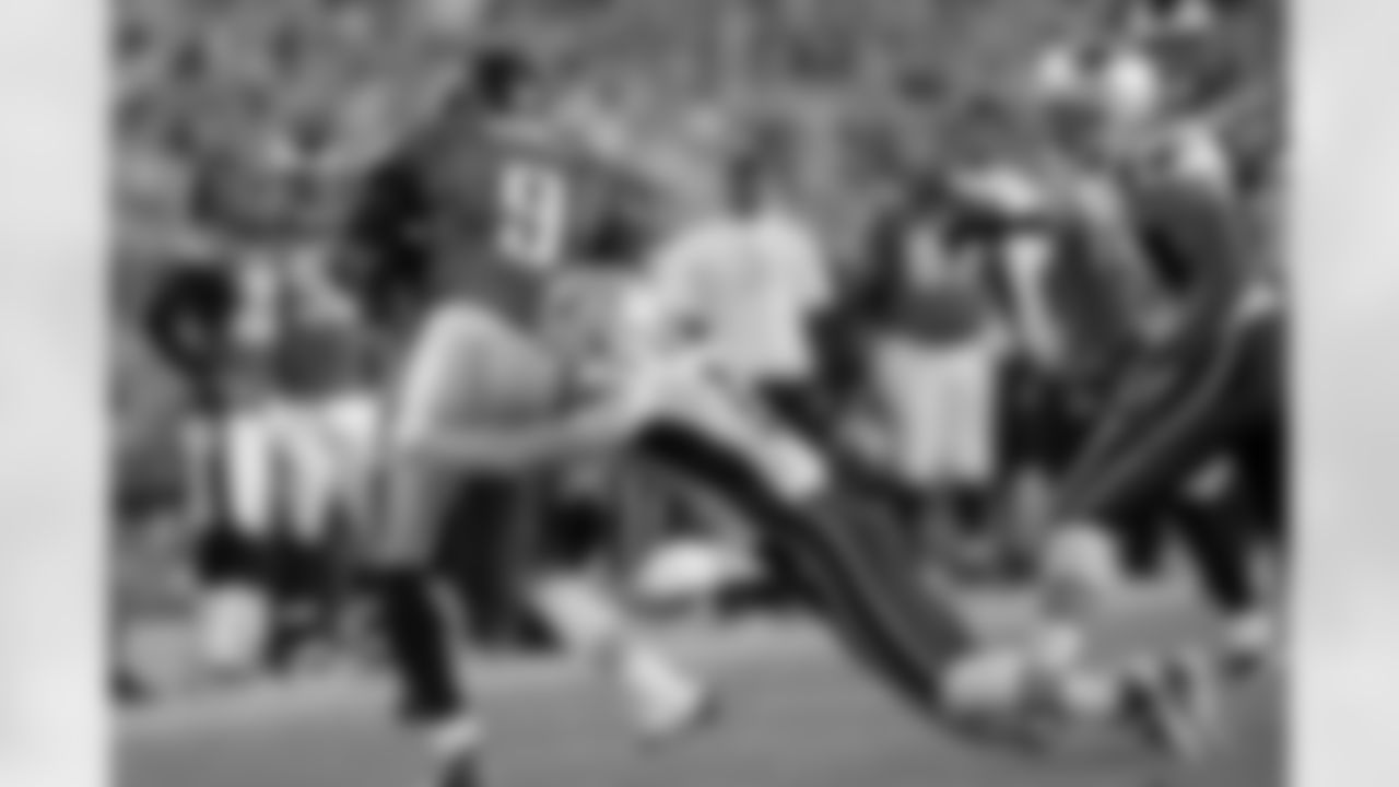 Patriots WE/DB Julian Edelman brings down Eagles QB Vince Young