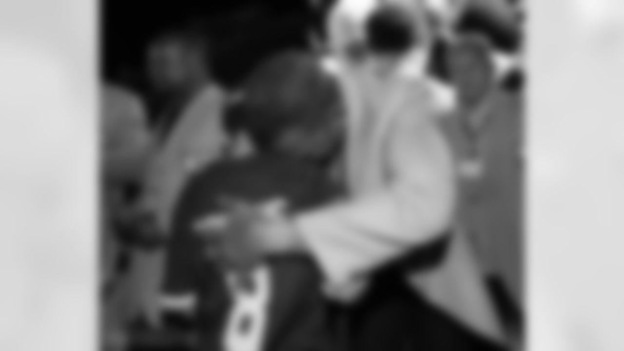 Natanel receives a hug from Andre Reed.
