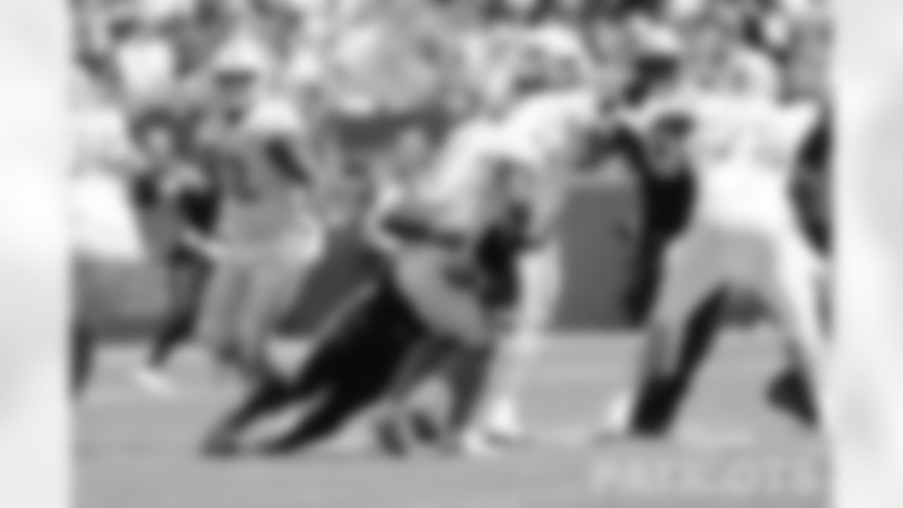 Matthew Judon (9) sacks Dolphins QB Tua Tagovailoa (1)