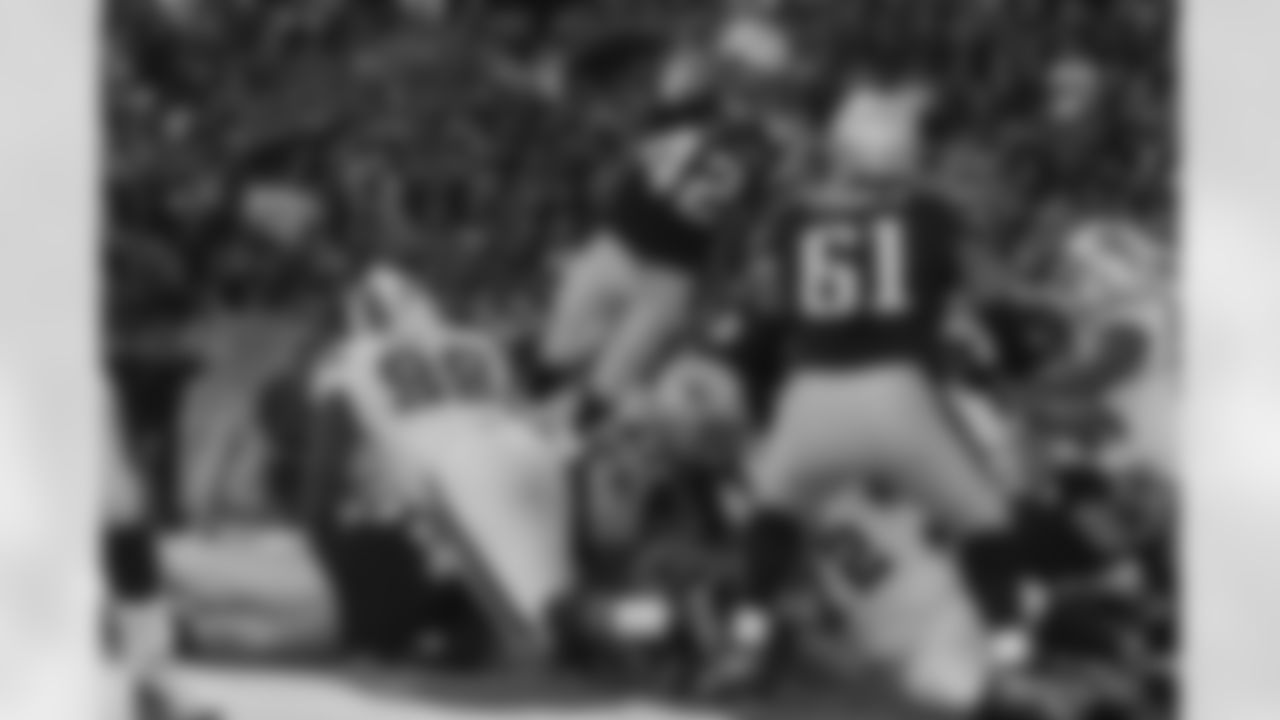 New England Patriots running back BenJarvus Green-Ellis flies over the pile to socre on of his two touchdowns