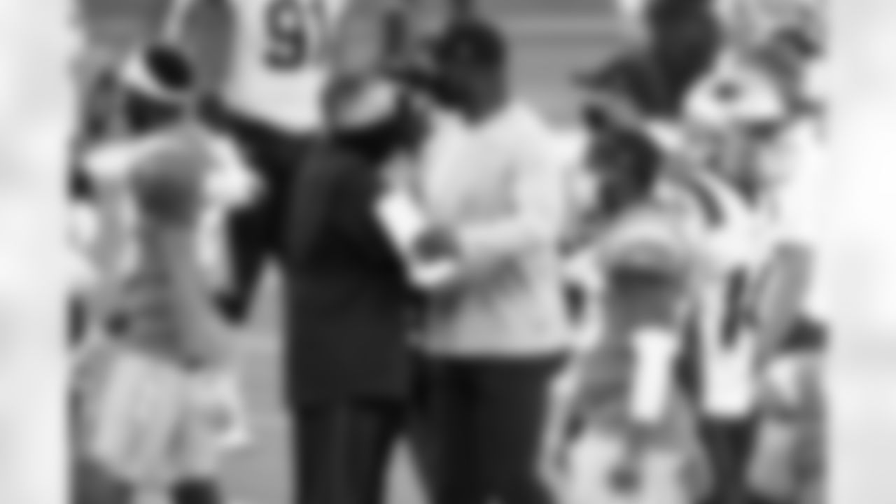 New England Patriots head coach Bill Belichick, center left, shakes hands with Los Angeles Chargers head coach Anthony Lynn at the end of an NFL football game Sunday, Dec. 6, 2020, in Inglewood, Calif. (AP Photo/Kelvin Kuo)
