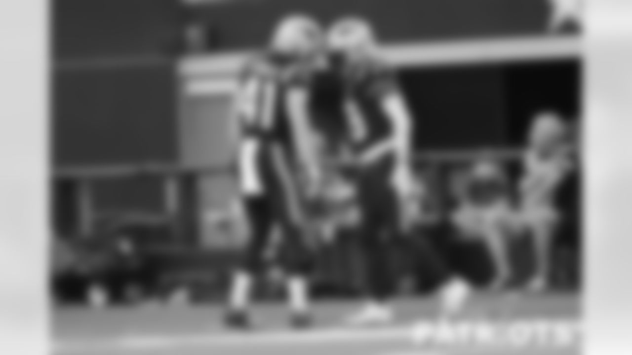 Patriots defensive back Brenden Schooler (41) and special teams captain Matthew Slater (18).