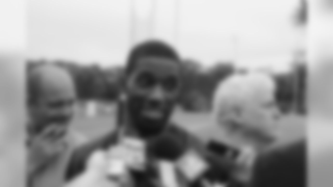Kyle Arrington talks with the media