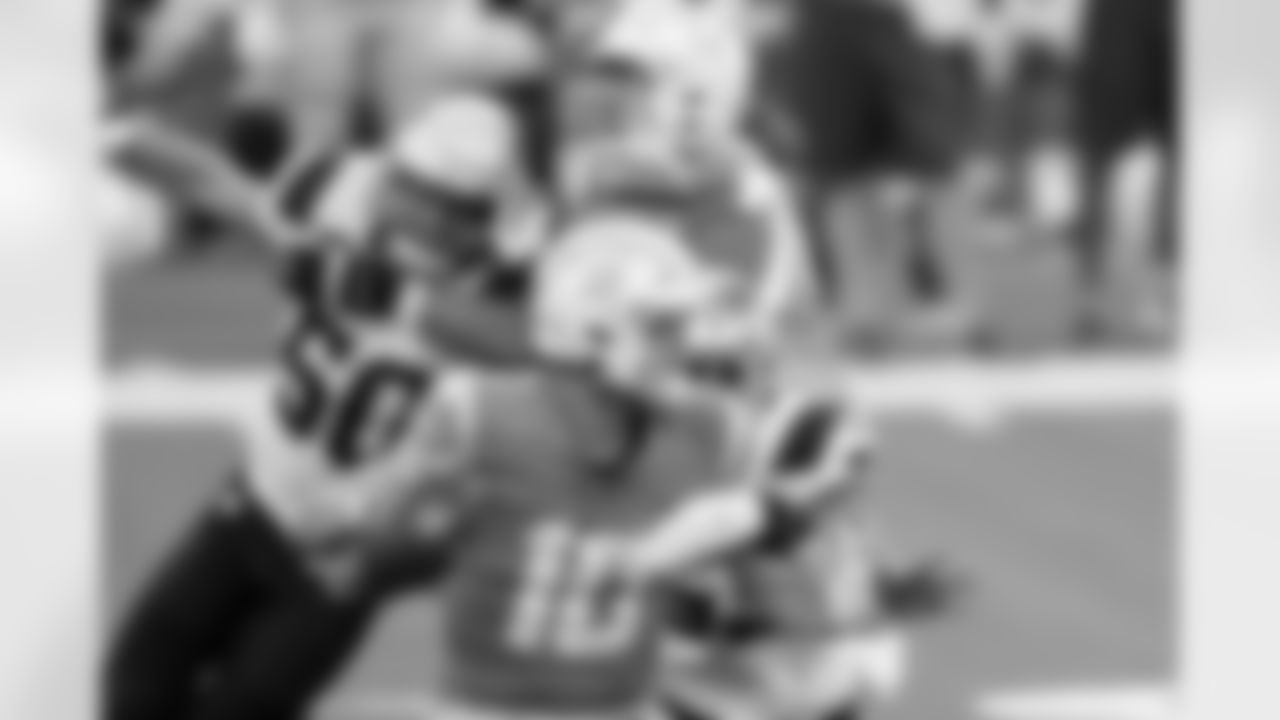Los Angeles Chargers quarterback Justin Herbert throws under pressure against the New England Patriots during the first half of an NFL football game Sunday, Dec. 6, 2020, in Inglewood, Calif. (AP Photo/Ashley Landis)