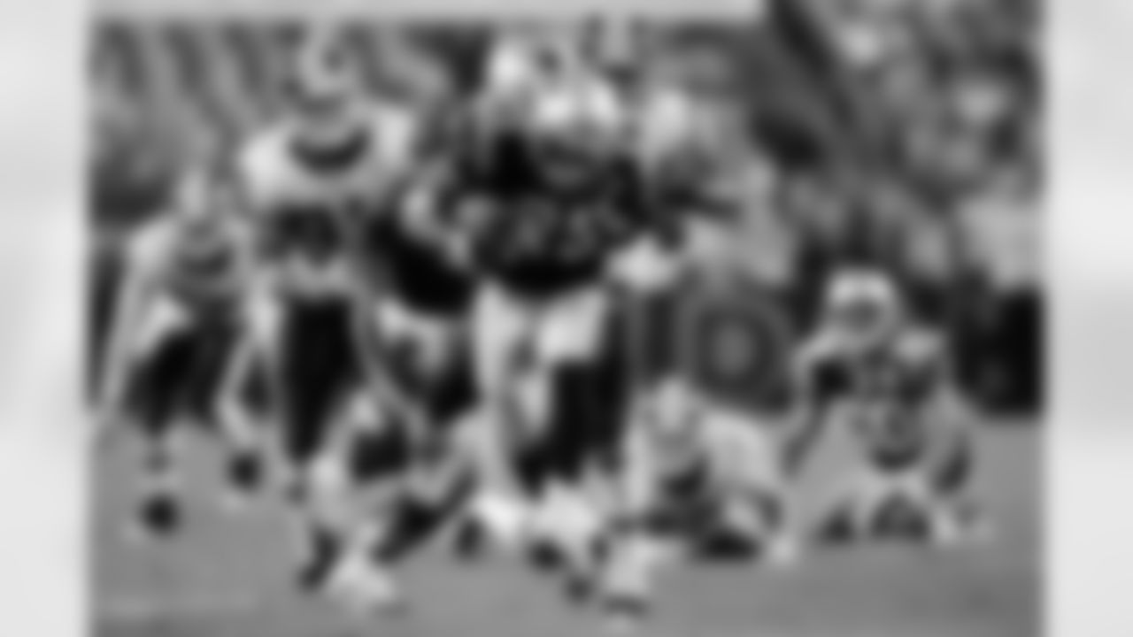 Landover, MD - AUGUST 28: Pat Chung #25 of the New England Patriots is tackled after gaining yardage against the Washington Redskins on August 28, 2009 at Fed Ex Field in Landover, Maryland. The New England Patriots defeated the Washington Redskins 27-24.