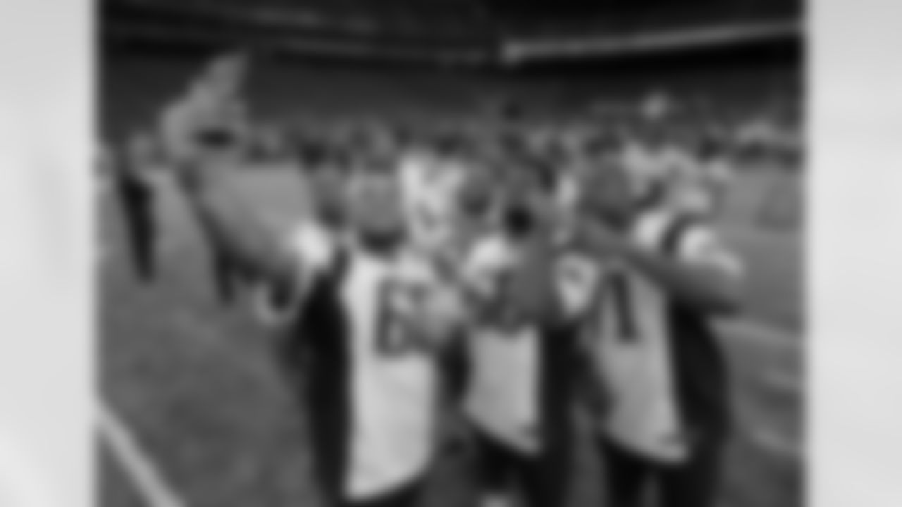 New England Patriots players take a selfie during a walk through at NRG Stadium, site of the NFL Super Bowl 51 football game, Saturday, Feb. 4, 2017, in Houston. The Patriots will face the Atlanta Falcons in the Super Bowl Sunday. (AP Photo/Charlie Riedel)
