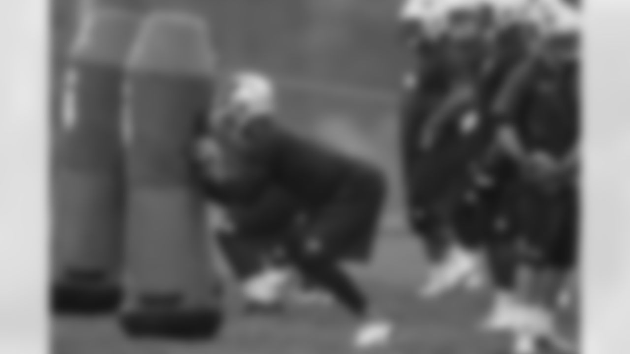 DL Michael Buchanan and the defensive line running drills