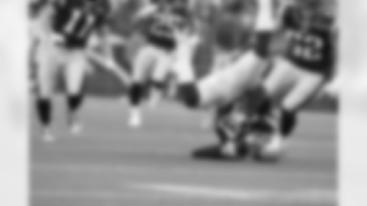 New England Patriots defensive back Sterling Moore hauls in one of his two interceptions
