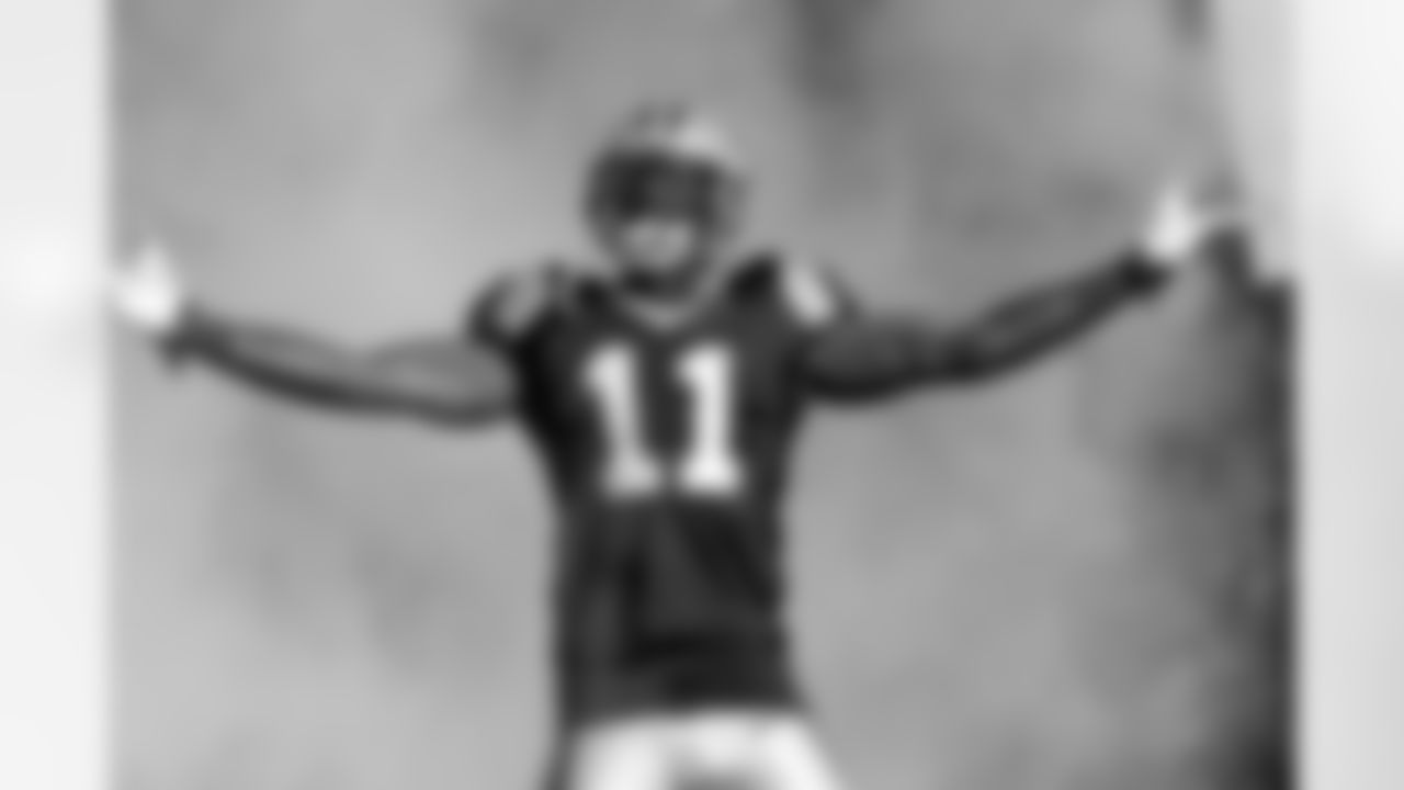 Carolina Panthers wide receiver Brandon LaFell (11) runs onto the field during player introductions prior to the start of an NFL football game against the Tampa Bay Buccaneers in Charlotte, N.C., Sunday, Dec.1, 2013. (AP Photo/Mike McCarn)