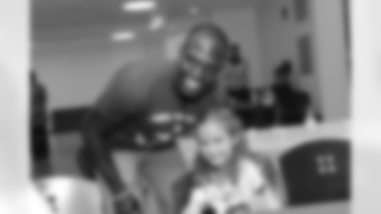BOSTON, MA - NOVEMBER 2: New England Patriot Devin McCourty signs an autograph for Adyson at Boston Children's Hospital November 2, 2015 in Boston, Massachusetts. (Photo by Darren McCollester/Getty Images for Boston Children's Hospital)