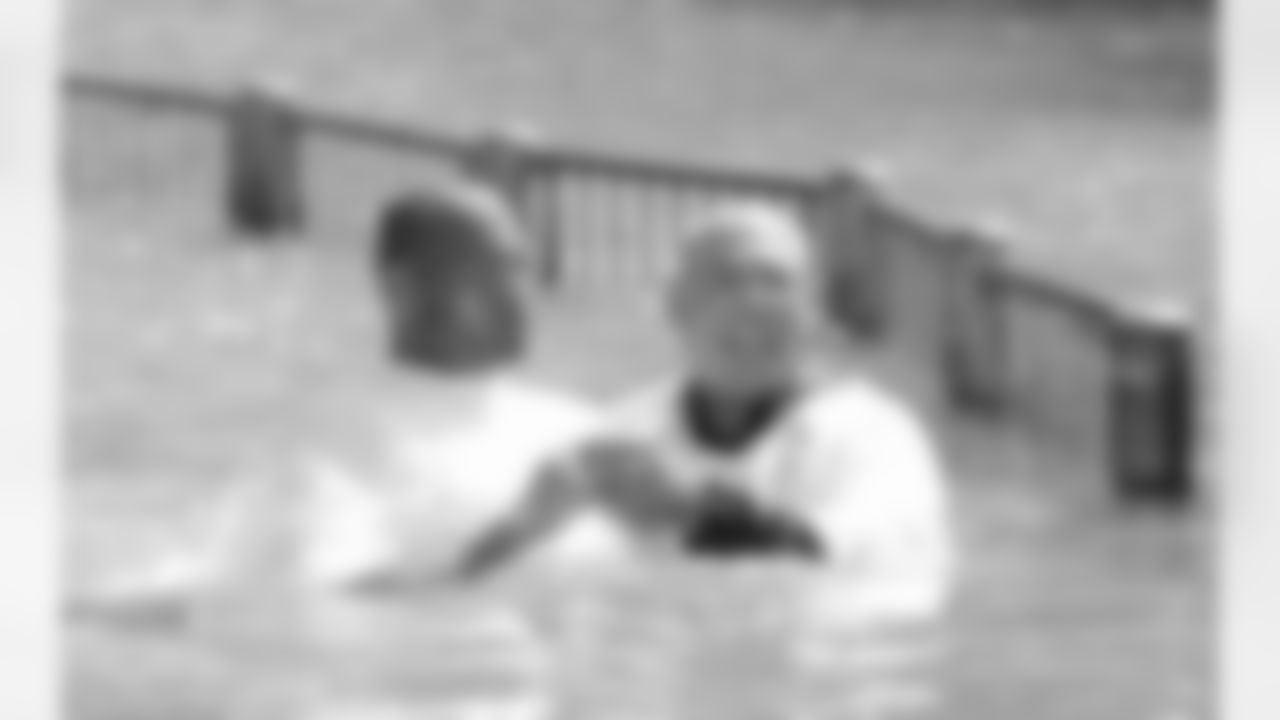 Aeneas Williams is baptized in the Jordan River.