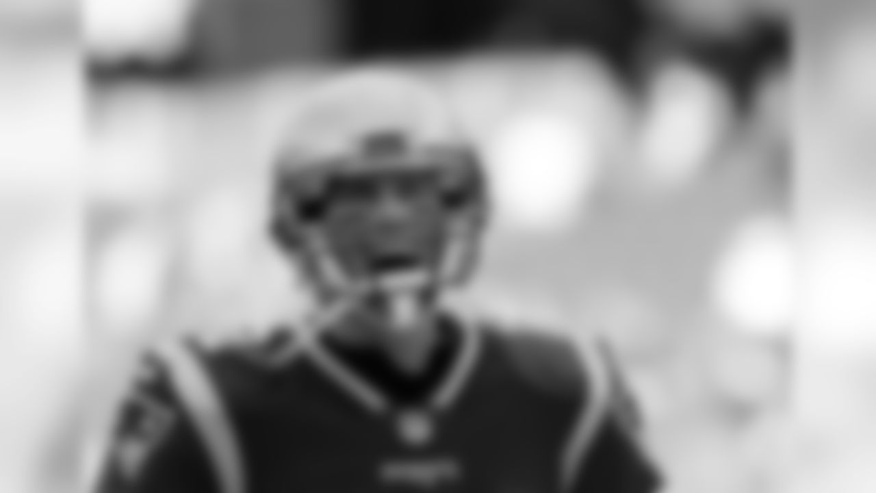 New England Patriots quarterback Tom Brady charges onto the field before an NFL football game against the Miami Dolphins, Sunday, Nov. 26, 2017, in Foxborough, Mass. (AP Photo/Michael Dwyer)