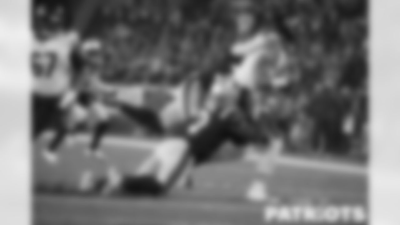 Matthew Judon and Mack Wilson Sr tackle Justin Fields on third down