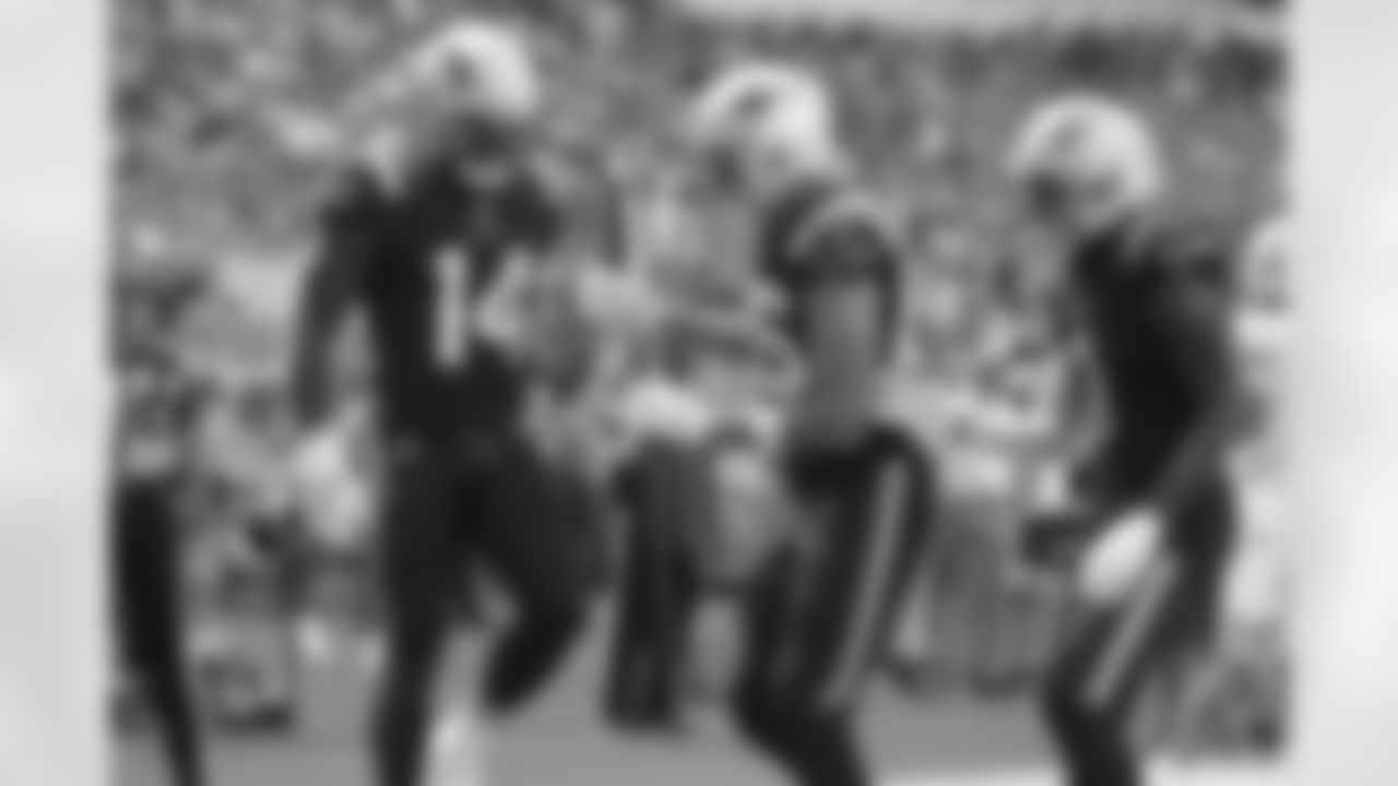 Ty Montgomery (14) celebrates his touchdown with Hunter Henry (85) and DeVante Parker (1)