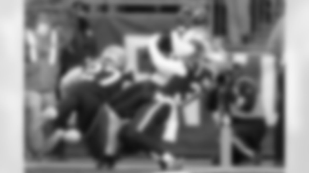 Cincinnati Bengals wide receiver Tee Higgins, center, enters the end zone for a touchdown.