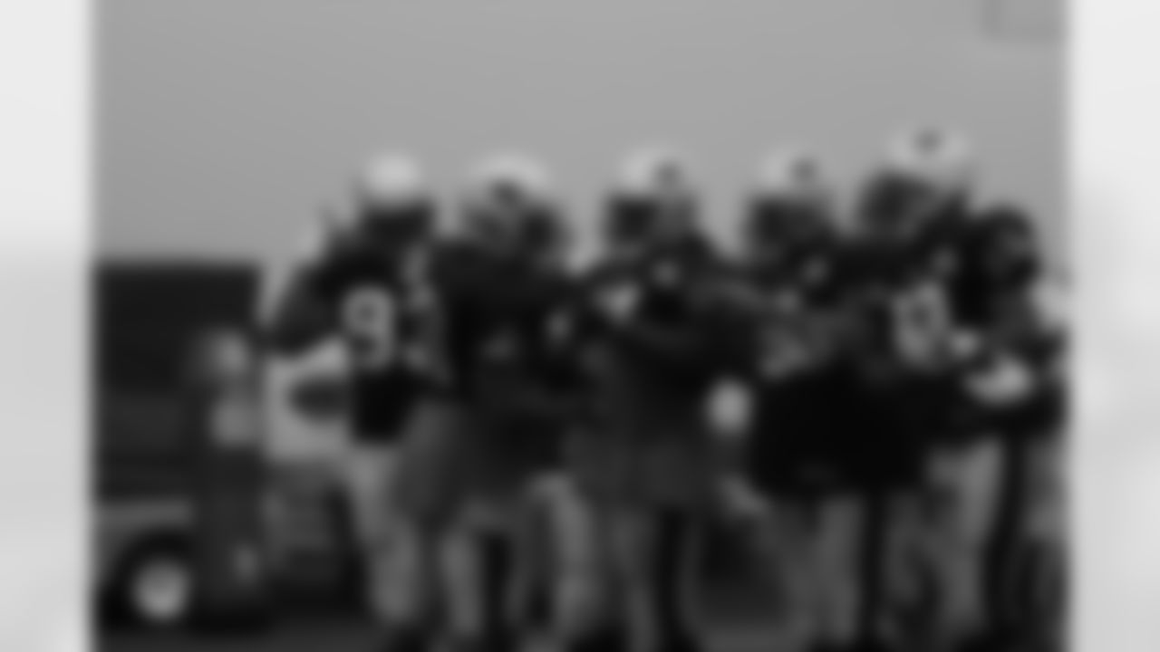 The Patriots defense breaks the huddle during practice