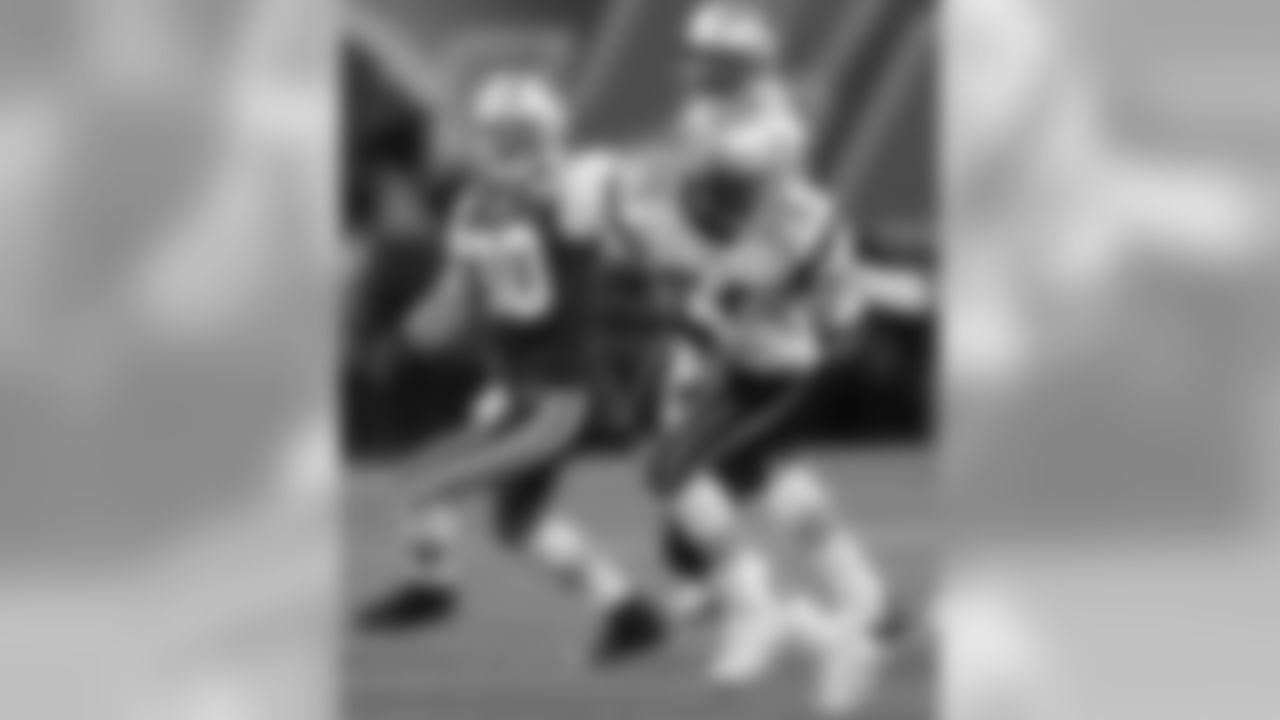 Tom Brady threw two TD passes and Chad Pennington was picked off twice, once by Eugene Wilson, in the Patriots' 23-7 win over the Jets on Dec. 26, 2004.