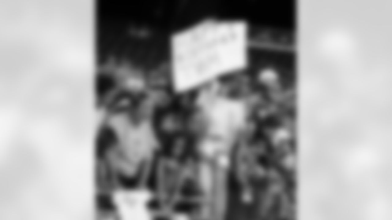 Fan holds up a sign celebrating Tom Brady's birthday