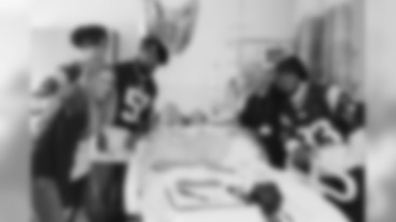 Jerod Mayo, Julian Edelman and Kevin Faulk visit a patient